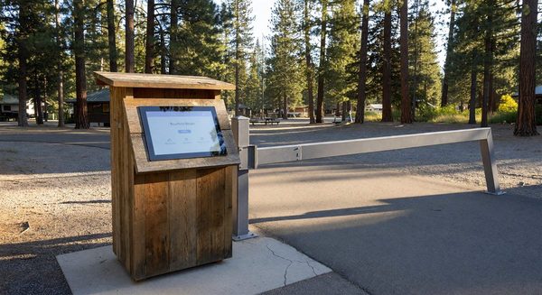 Campground self-check-in kiosk at entrance with digital touchscreen interface