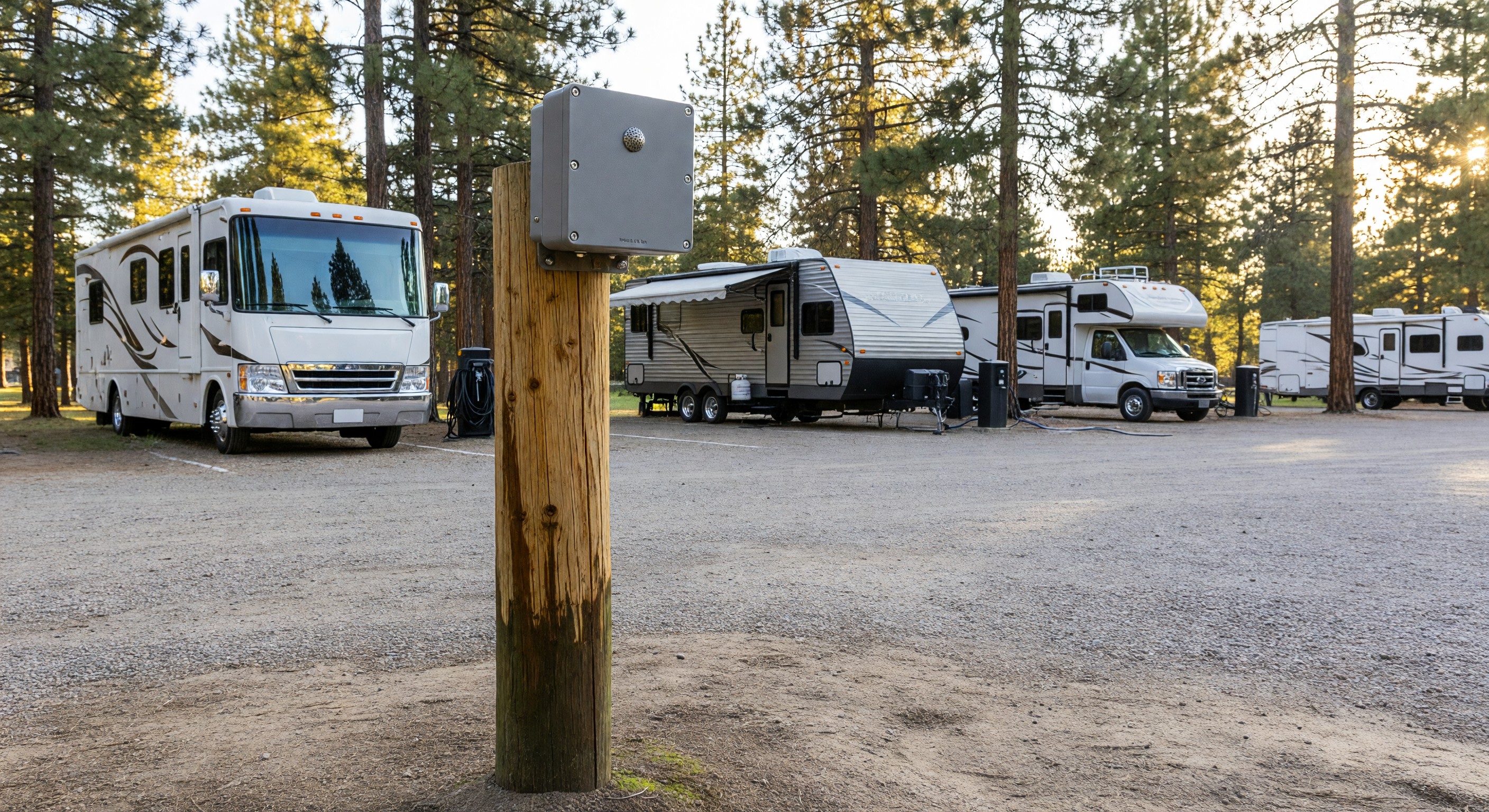 Decibel monitoring sensor mounted on a campground post near RV sites