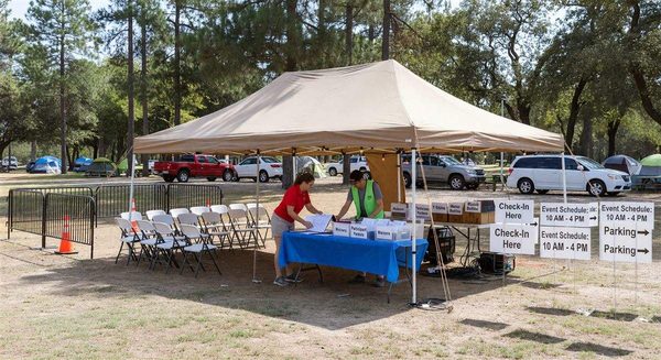 Campground special event setup with registration tent and organized event infrastructure