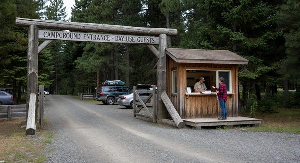 Campground entrance gate with visitor check-in kiosk for day-use guests