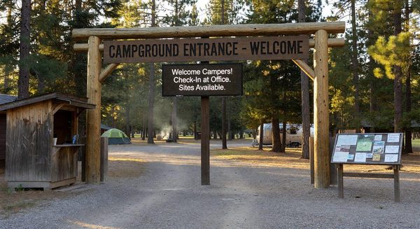 Welcoming campground entrance with clear signage and a digital welcome display